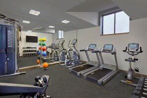 Stay fit and active with our well-equipped gym featuring treadmills, ellipticals, and a stationary bike.