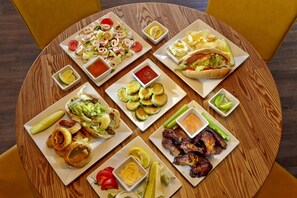 Enjoy a communal dining experience with a variety of dishes served on a round table.