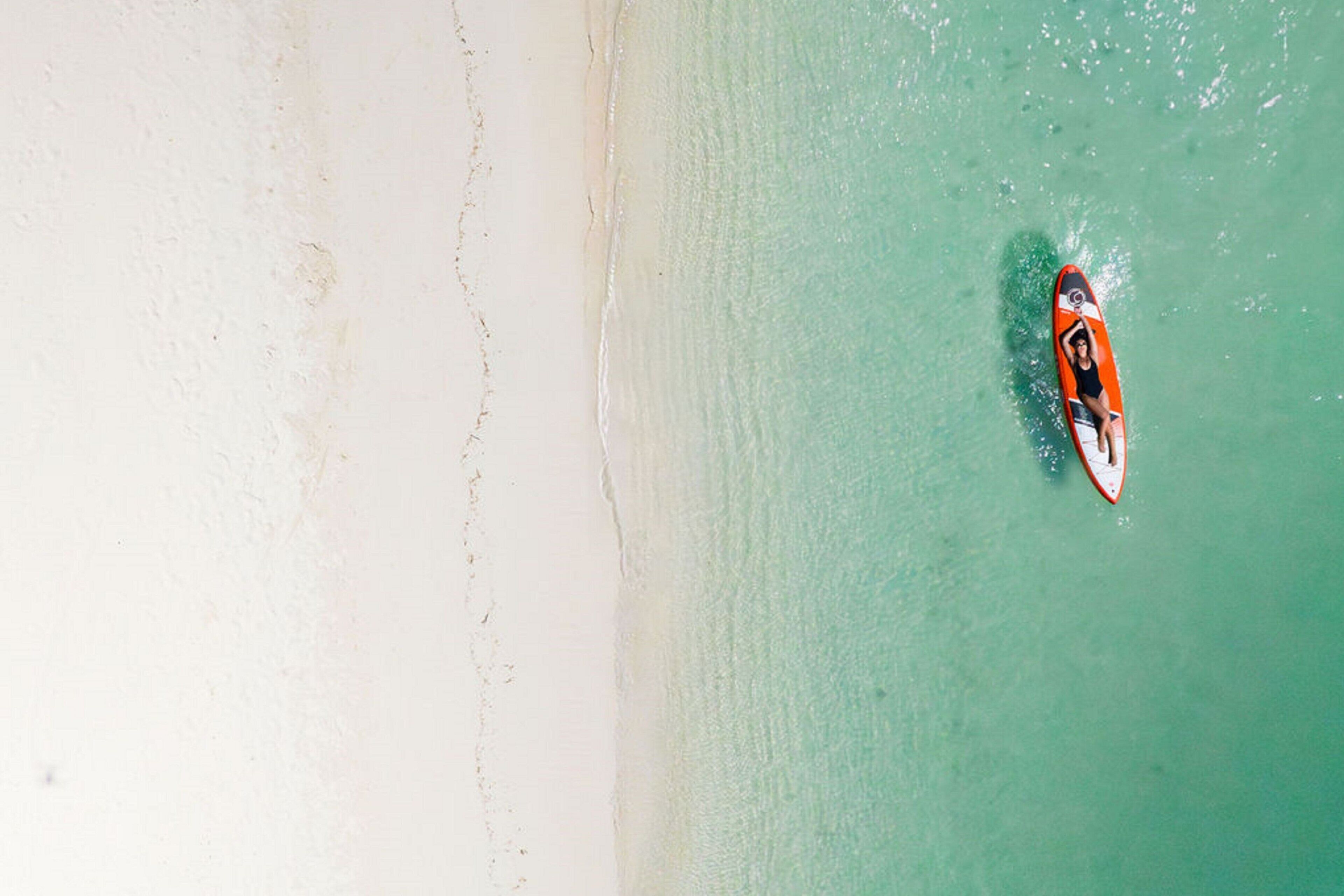 on the beach, white sand, kayaking