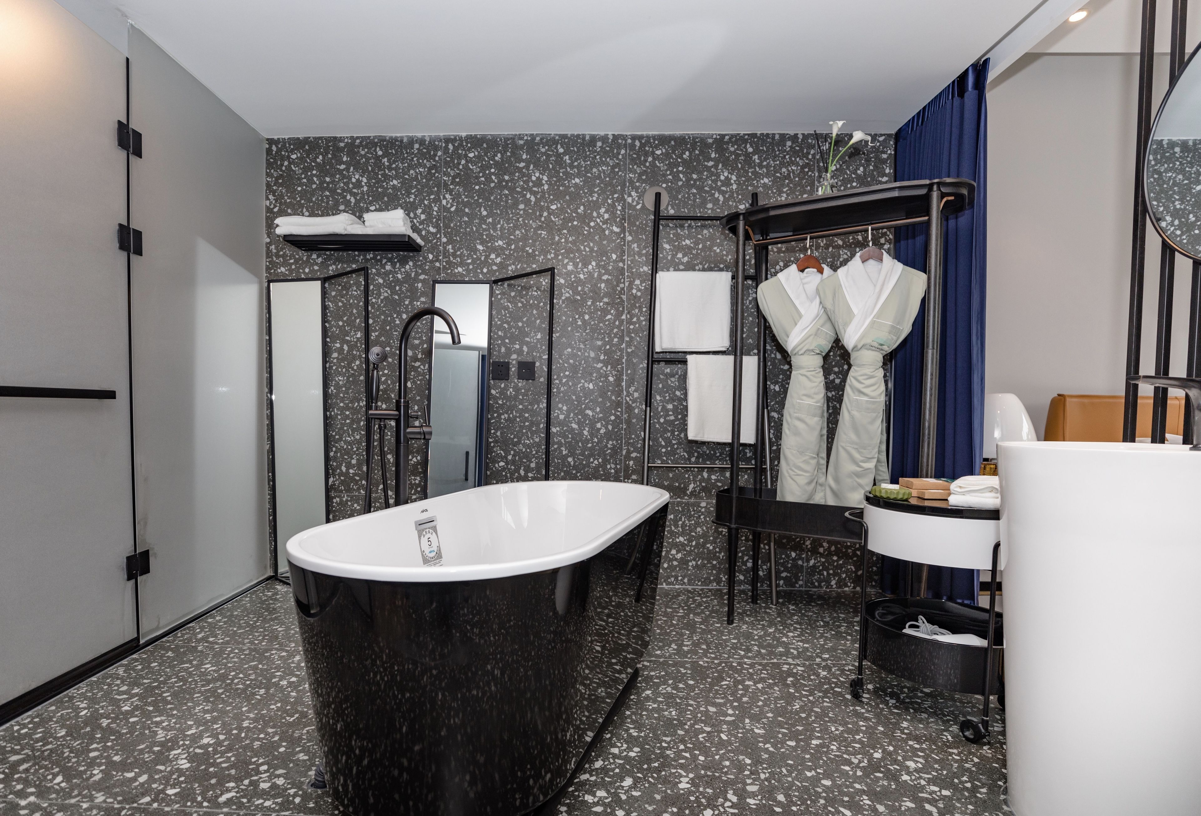 deluxe suite garden view | bathroom | free toiletries, hair dryer, bathrobes, slippers