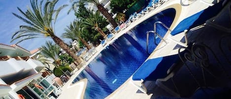 Indoor pool, outdoor pool, open 8 AM to 8 PM, pool umbrellas