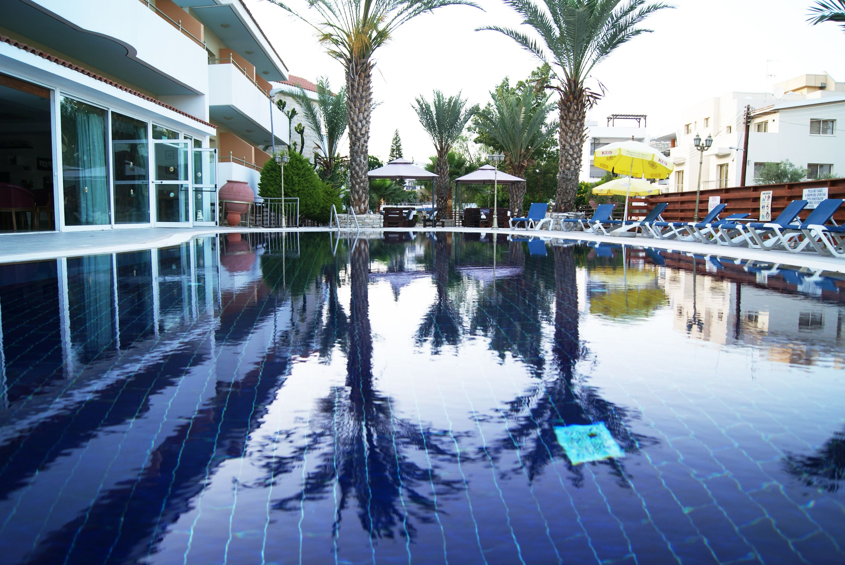 Indoor pool, outdoor pool, open 8 AM to 8 PM, pool umbrellas