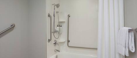 A bathroom with a bathtub, a shower with a handheld showerhead, a handheld showerhead, a handheld showerhead, a handheld showerhead, a handheld showerhead, a handheld showerhead, a handheld showerhead, a handheld showerhead, a handheld showerhead, a handheld showerhead, a handheld showerhead, a handheld showerhead, a handheld showerhead, a handheld showerhead, a handheld showerhead, a handheld showerhead, a handheld showerhead, a handheld showerhead, a handheld showerhead, a handheld showerhead, a handheld showerhead, a handheld showerhead, a handheld showerhead, a handheld showerhead, a handheld showerhead, a handheld showerhead, a handheld showerhead, a handheld showerhead, a handheld showerhead, a handheld showerhead, a handheld showerhead, a handheld showerhead, a handheld showerhead, a handheld showerhead, a handheld showerhead, a handheld showerhead, a handheld showerhead, a handheld shower