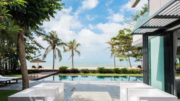 Premium Beachfront Pool Residence | Living room | 20-inch flat-screen TV with satellite channels, TV, DVD player - Sanctuary Residential Resort Community (Ho Chi Minh City)