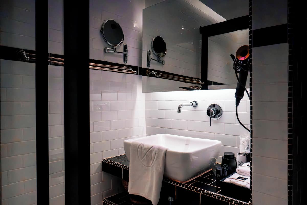 superior queen or twin | bathroom | shower, hair dryer, slippers, towels