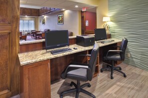 A hotel business center with two desktop computers, a printer, and office chairs. - Holiday Inn Express Hotel & Suites Frankenmuth by IHG (Frankenmuth)