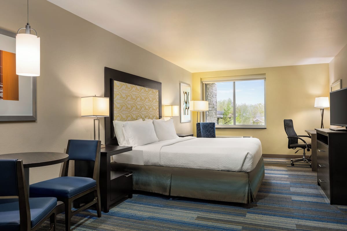 Premium bedding, desk, laptop workspace, soundproofing