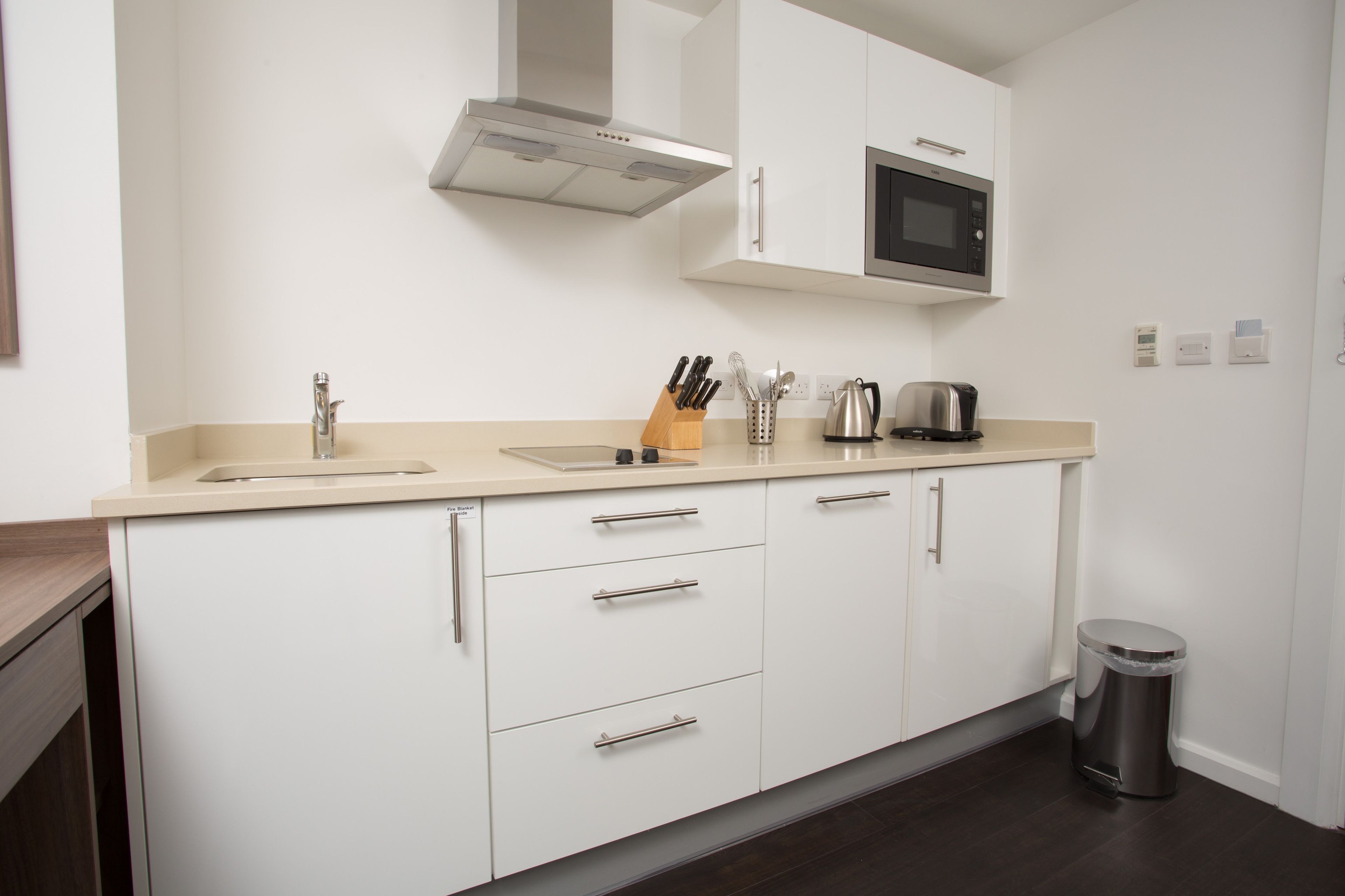 full-sized fridge, microwave, stovetop, dishwasher