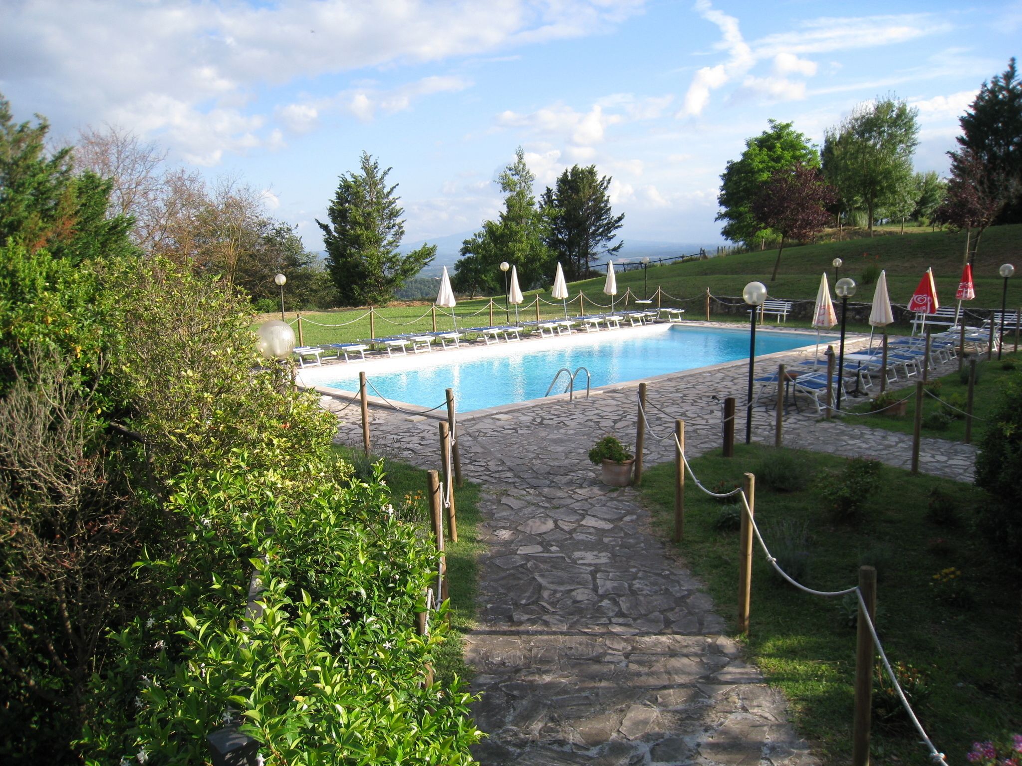 Outdoor pool, open 9:00 AM to 7:30 PM, pool umbrellas, pool loungers