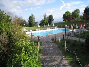 Outdoor pool, open 9:00 AM to 7:30 PM, pool umbrellas, pool loungers