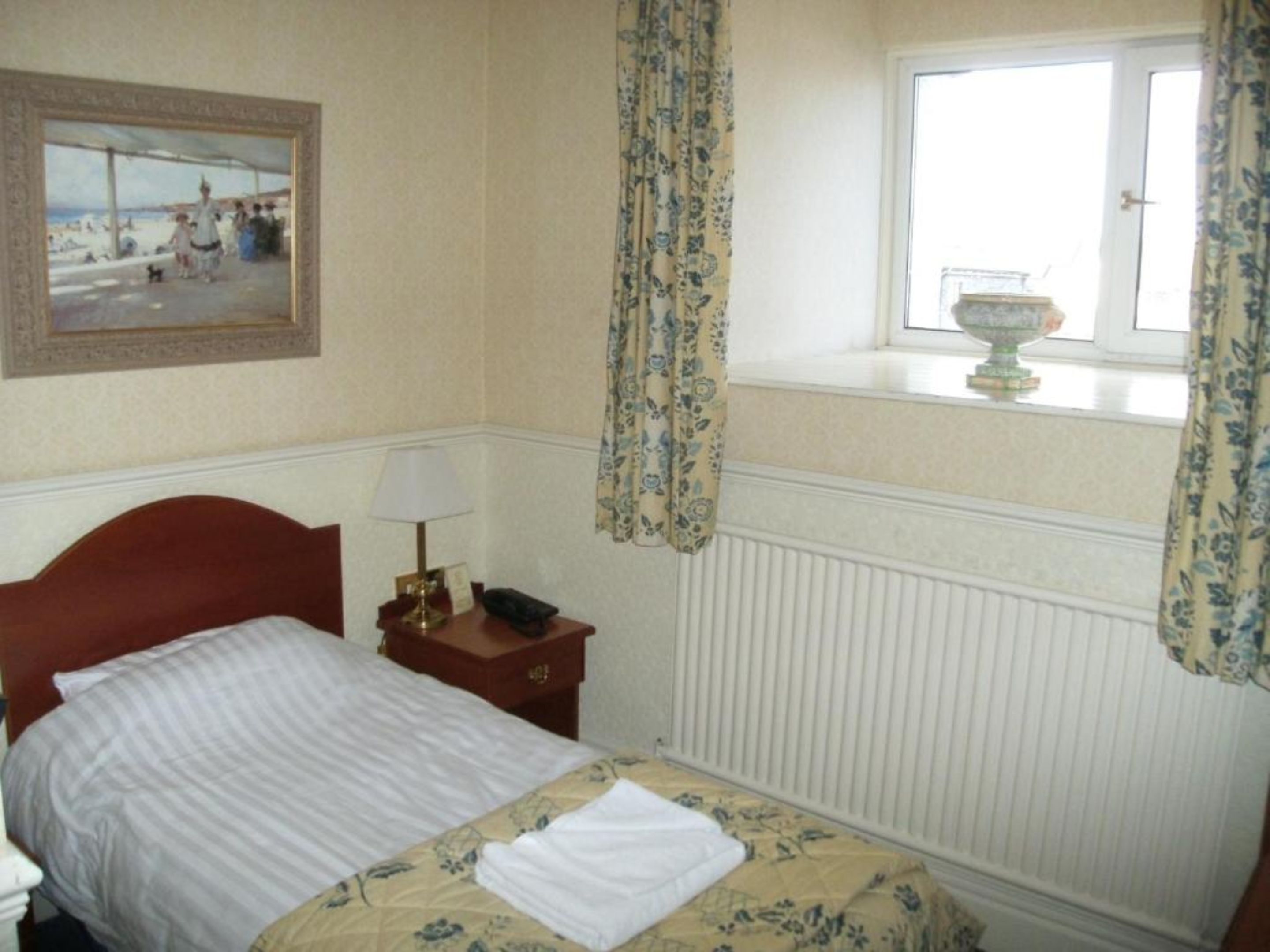 single room | premium bedding, blackout curtains, iron/ironing board, rollaway beds