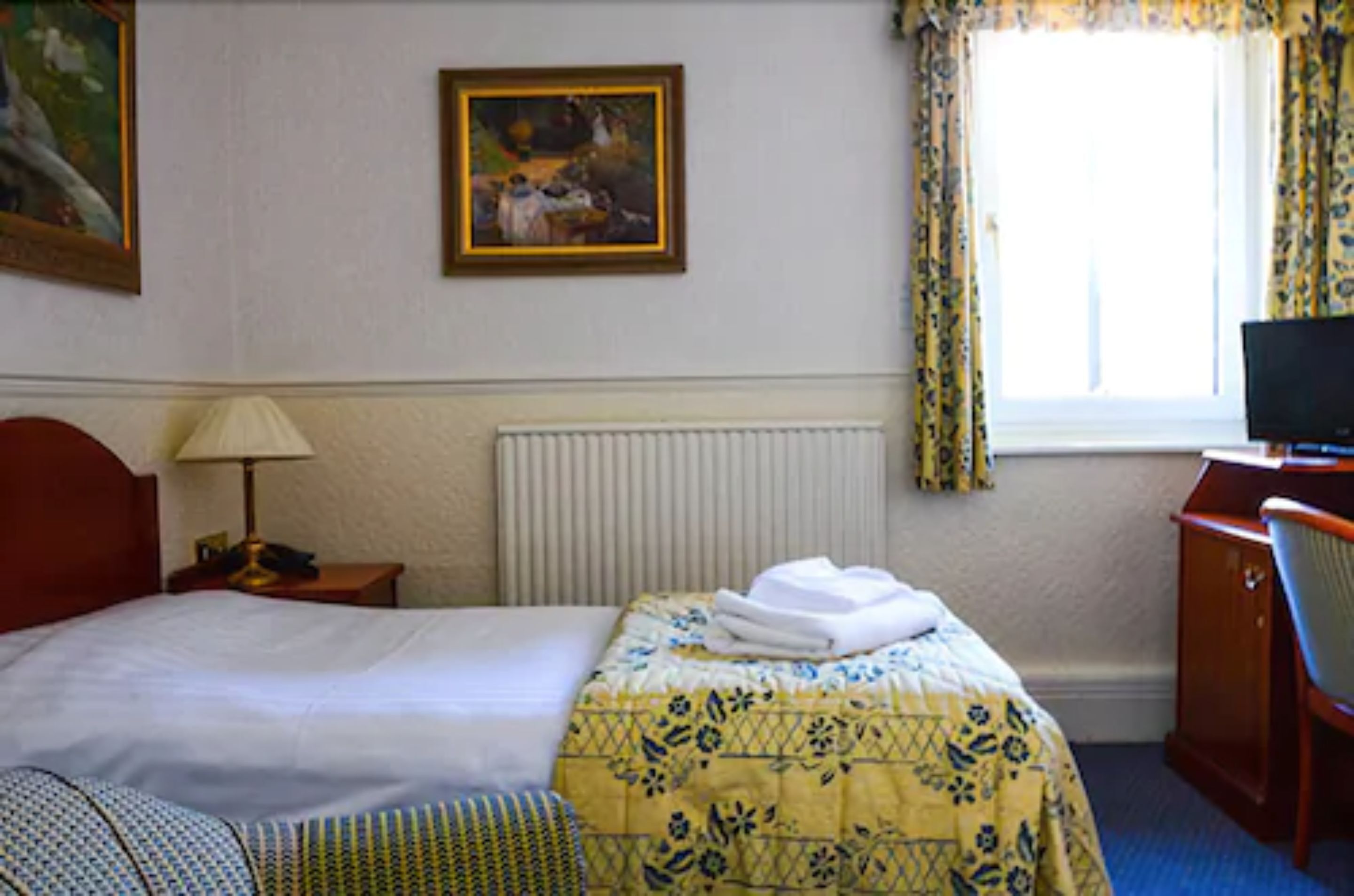 single room | premium bedding, blackout curtains, iron/ironing board, rollaway beds