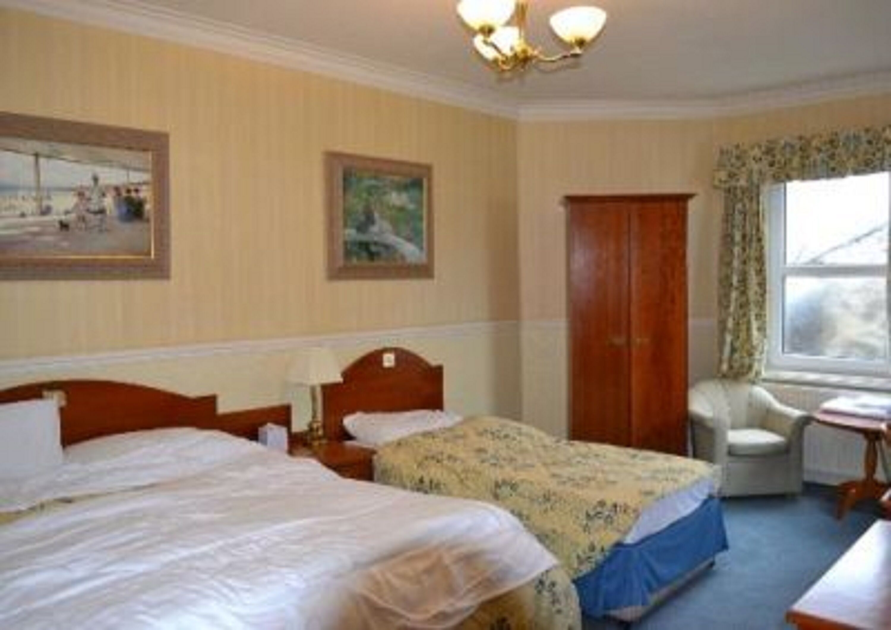 family room | premium bedding, blackout curtains, iron/ironing board, rollaway beds