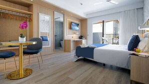 A modern hotel room with a bed, a desk, a chair, a TV, and a balcony. - Broncemar Beach (Antigua)