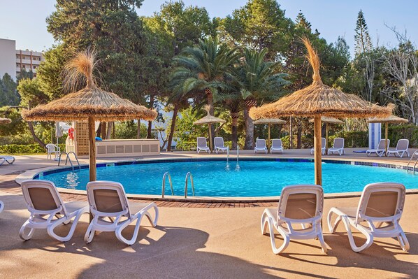 Outdoor pool, open 10:00 AM to 6:00 PM, pool umbrellas, pool loungers