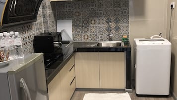 Family Apartment, 3 Bedrooms | Private kitchen | Fridge, microwave, coffee/tea maker, electric kettle