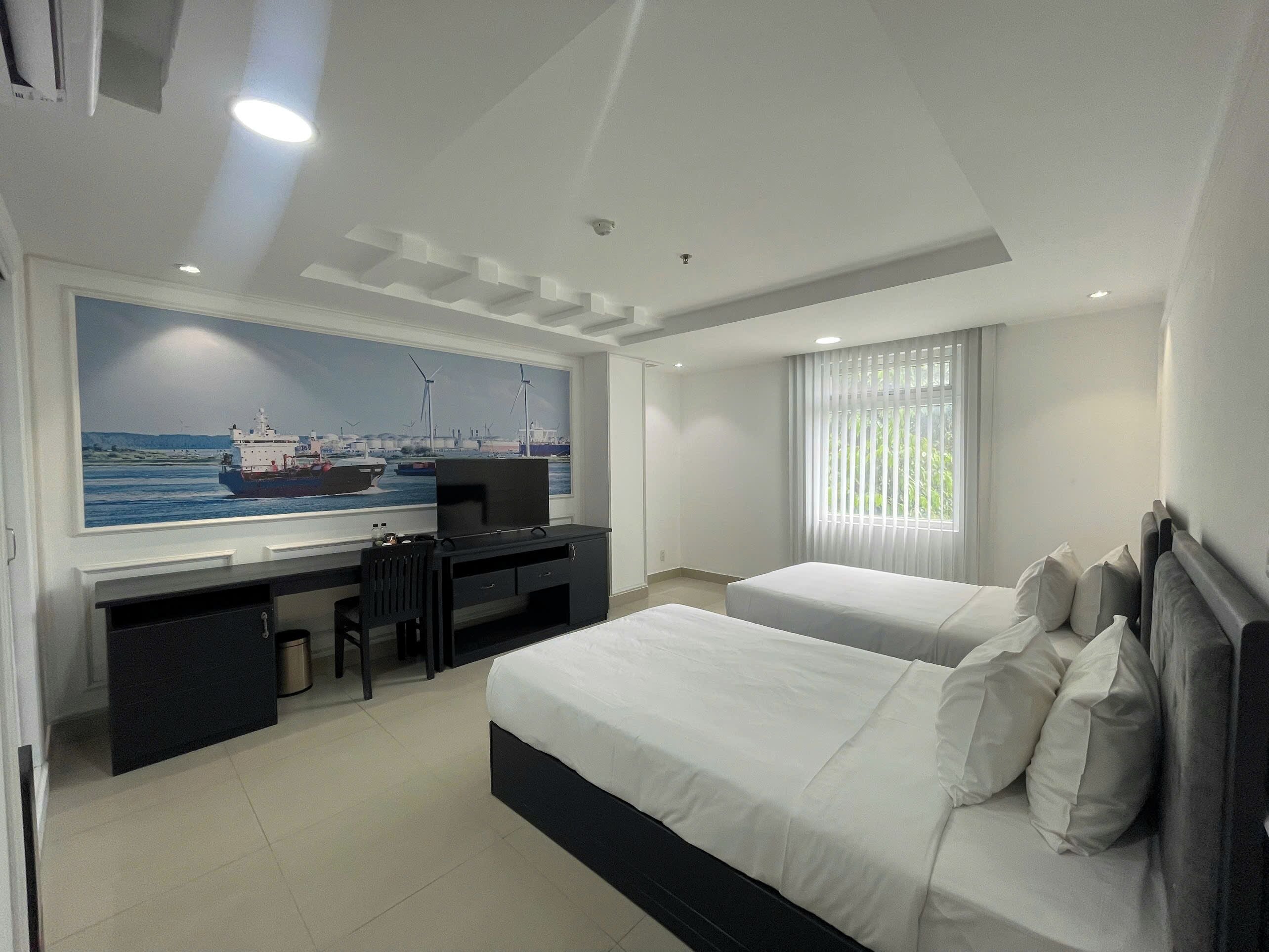 Quarto duplo executivo, vista para o rio | Frigobar, cofres nos quartos, escrivaninha, cortinas blackout