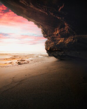 Beach nearby, black sand, beach towels