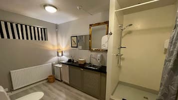 Shower, hair dryer, slippers, towels