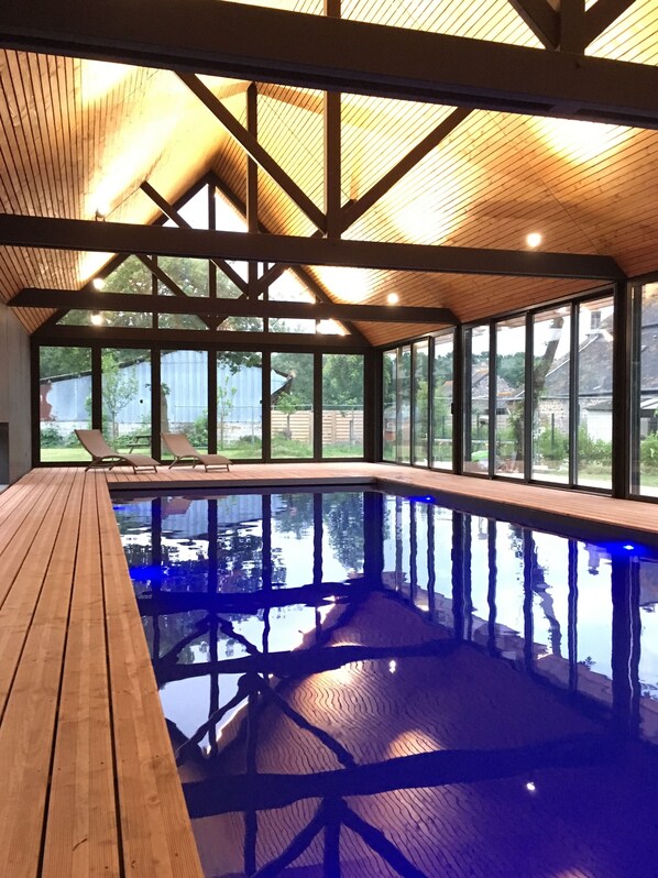 Indoor pool, open 9:00 AM to 8:00 PM, pool loungers