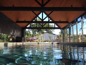 Indoor pool, open 9:00 AM to 8:00 PM, pool loungers