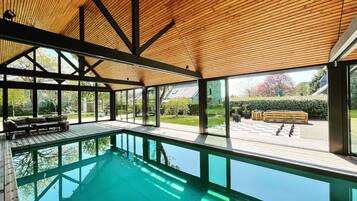 Indoor pool, open 9:00 AM to 8:00 PM, pool loungers