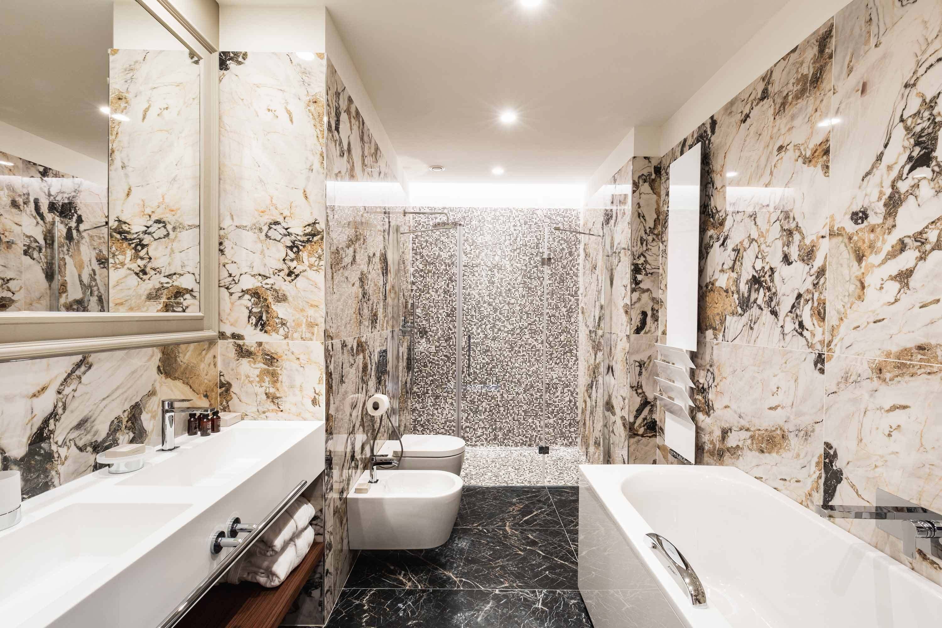 executive suite | bathroom | rainfall showerhead, eco-friendly toiletries, hair dryer, bathrobes