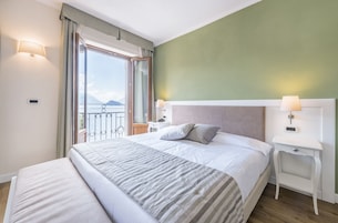Superior Room, Lake View | Down comforters, minibar, in-room safe, desk