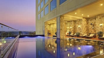 Outdoor pool, open 6:00 AM to 9:00 PM, pool umbrellas, pool loungers
