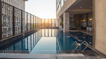 Outdoor pool, open 6:00 AM to 9:00 PM, pool umbrellas, sun loungers