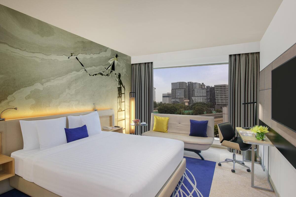 Chambre « Premier », 1 très grand lit, accès au salon club, niveau Exécutif