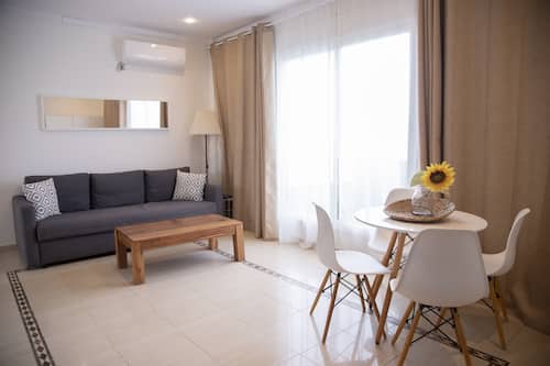 Premium Apartment, 1 Bedroom, Ocean View | Living area | Plasma TV