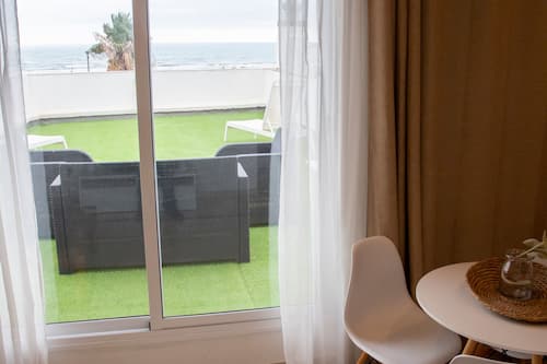 Premium Apartment, 1 Bedroom, Ocean View | Living area | Plasma TV