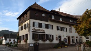 A two-story building with a sign reading "Auerbach".