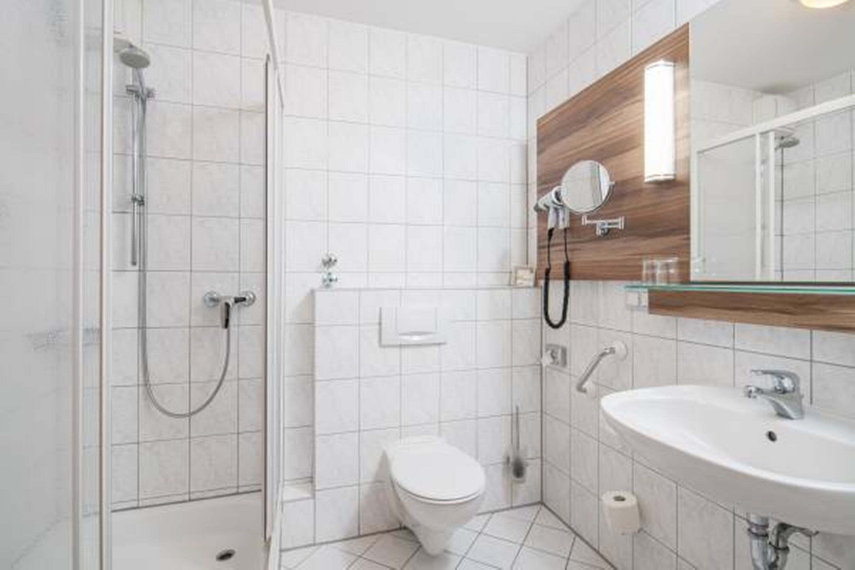 shower, hair dryer, slippers, towels