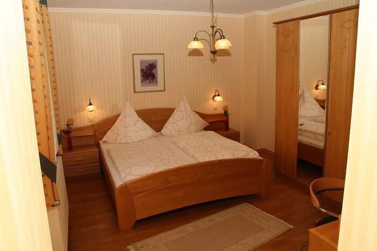 desk, laptop workspace, blackout curtains, iron/ironing board