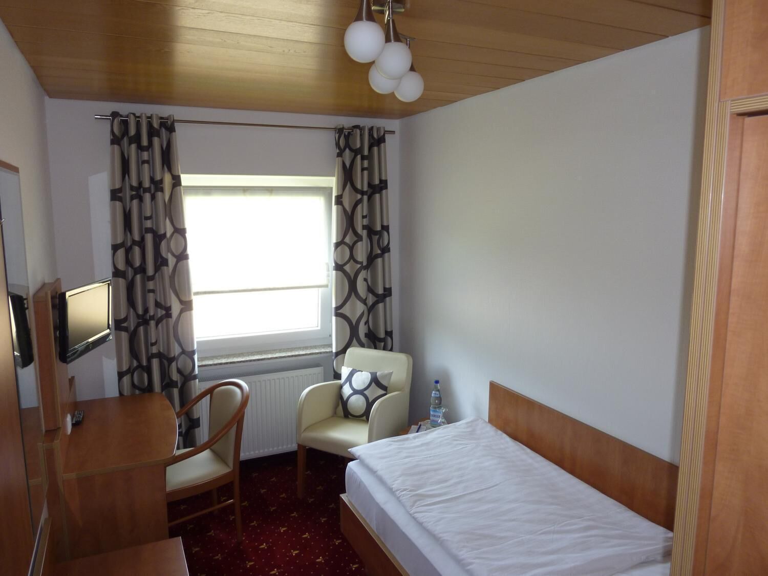 desk, laptop workspace, blackout curtains, iron/ironing board