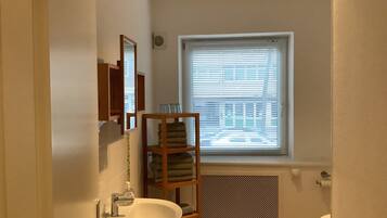 Apartment, 1 Bedroom | Bathroom | Shower, hair dryer, towels