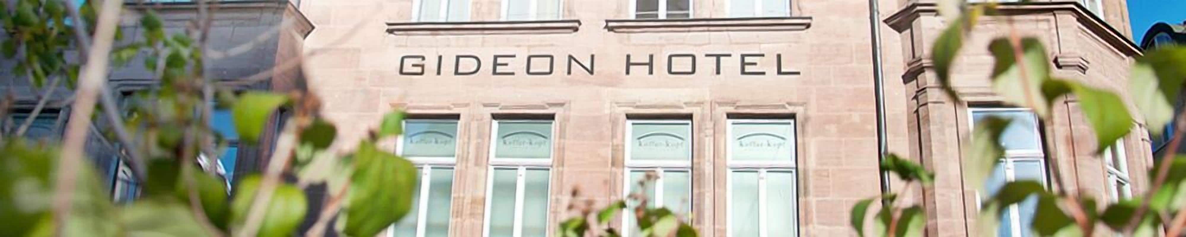 The exterior of the Gideon Hotel with its name displayed prominently above the windows.