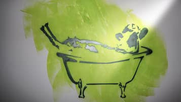 A green bathtub with a black outline.