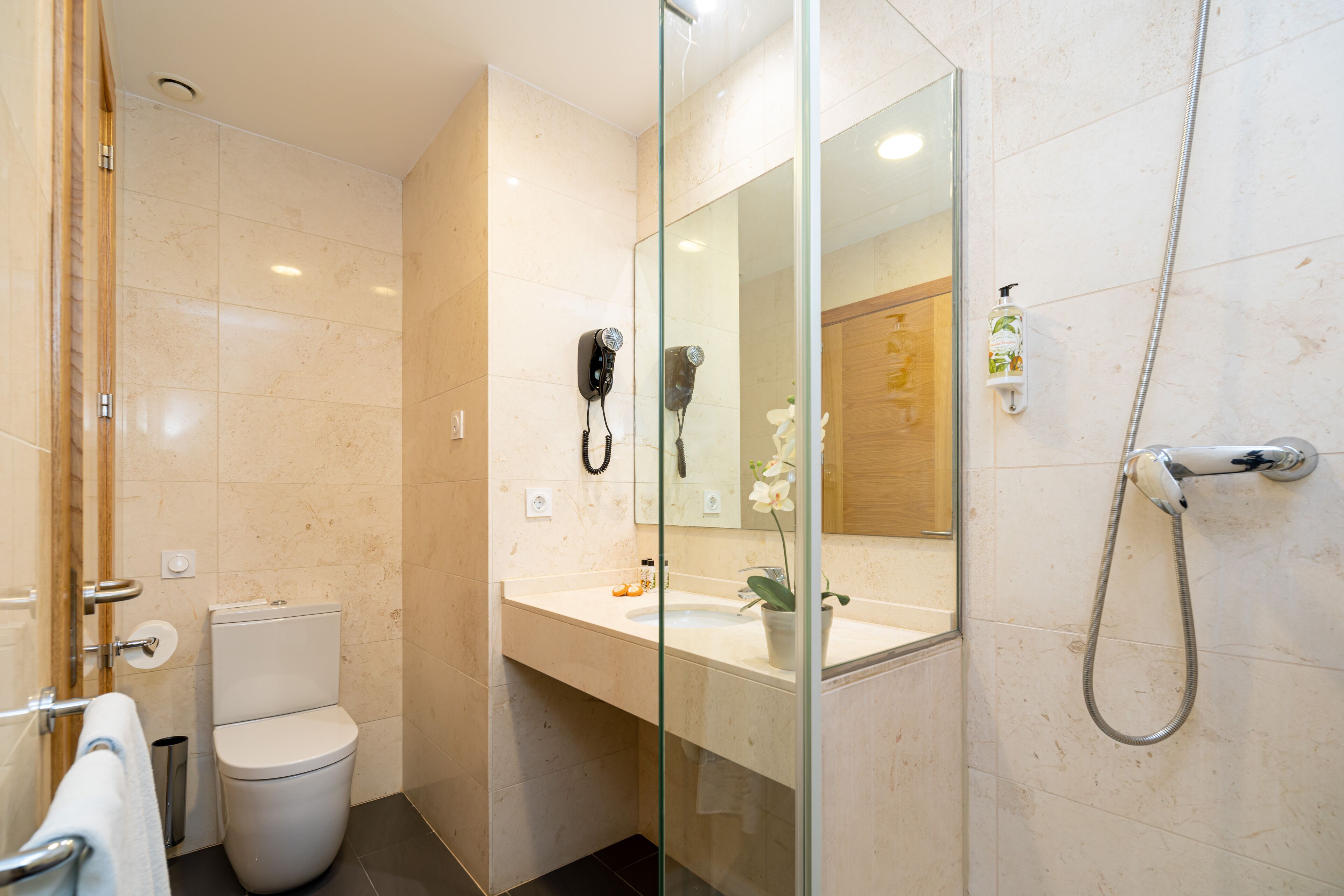 designer toiletries, hair dryer, towels, soap