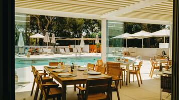 Breakfast, lunch, dinner served; Mediterranean cuisine, pool views
