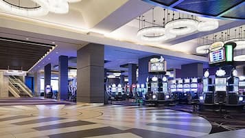 Enjoy gaming and entertainment in this area with a geometric floor pattern and high ceiling.