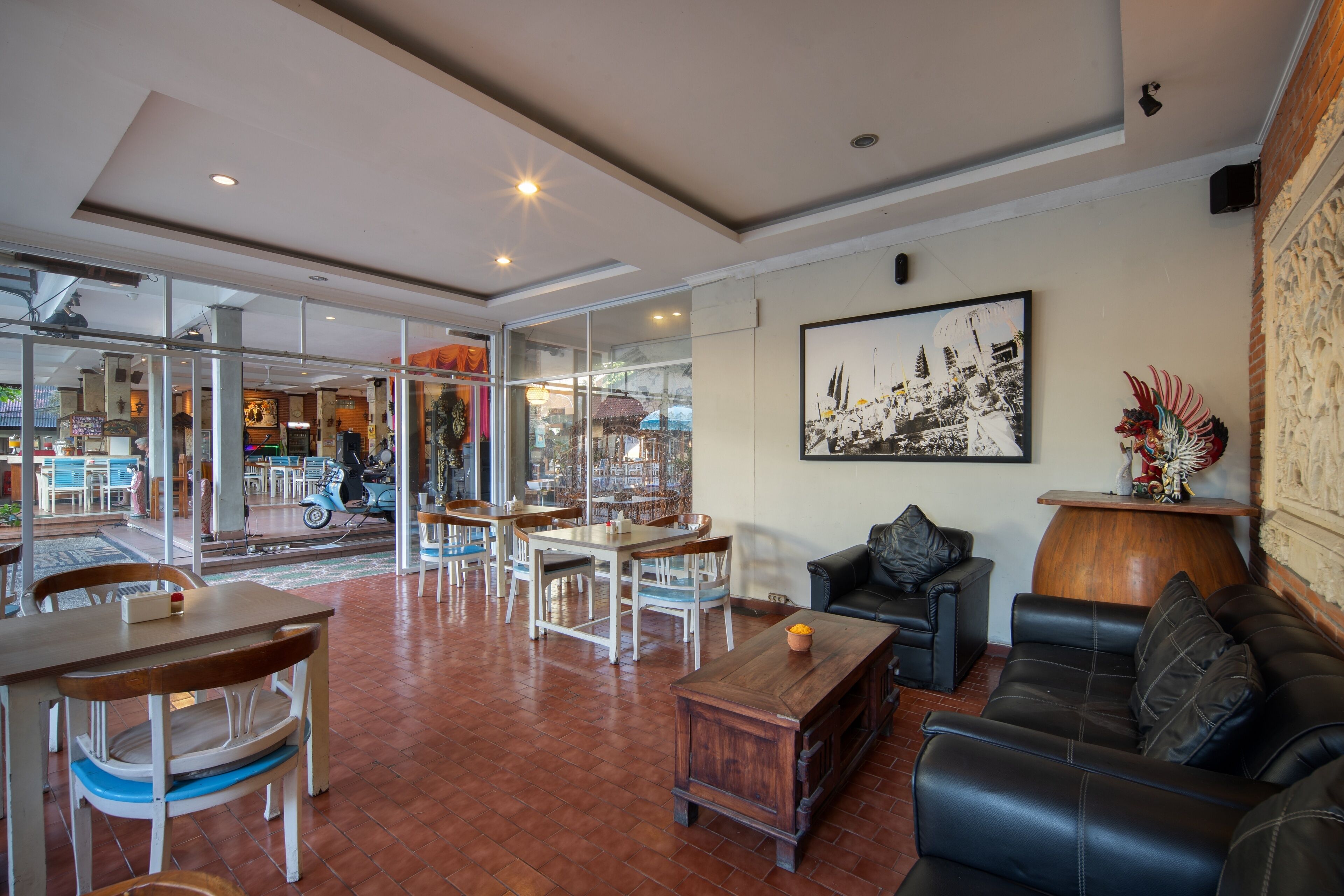 A spacious indoor area with a dining area, a sofa, and a coffee table.