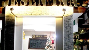 A hotel entrance with a sign reading "JESEN INN". - Jesens Inn 2 (Kuta)