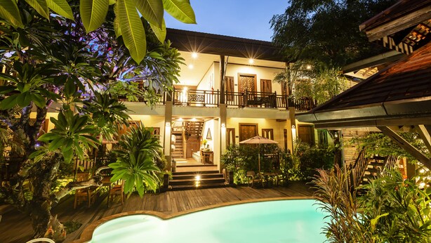 A two-story building with a pool, surrounded by lush greenery. - Amata Lanna Chiang Mai One Member of The Secret Retreat (Chiang Mai)