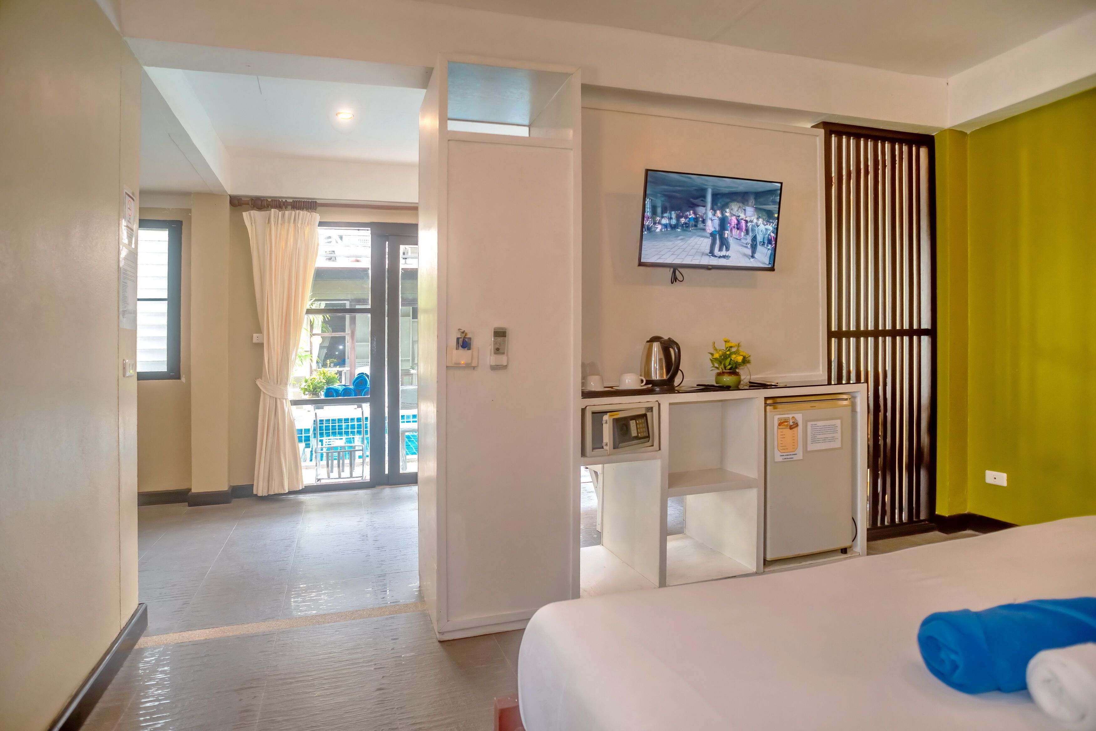 superior mini suite pool view | minibar, in-room safe, individually furnished, desk