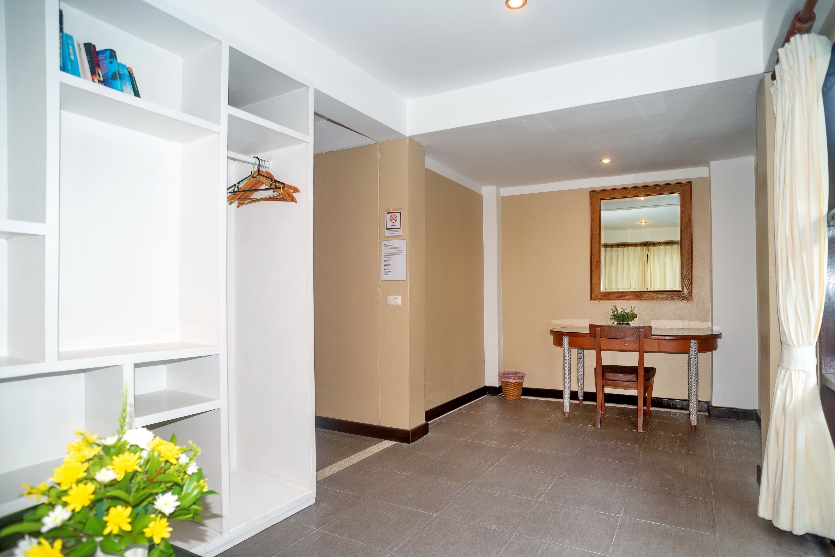 superior mini suite pool view | living area | tv