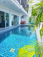 Outdoor pool, pool umbrellas, sun loungers