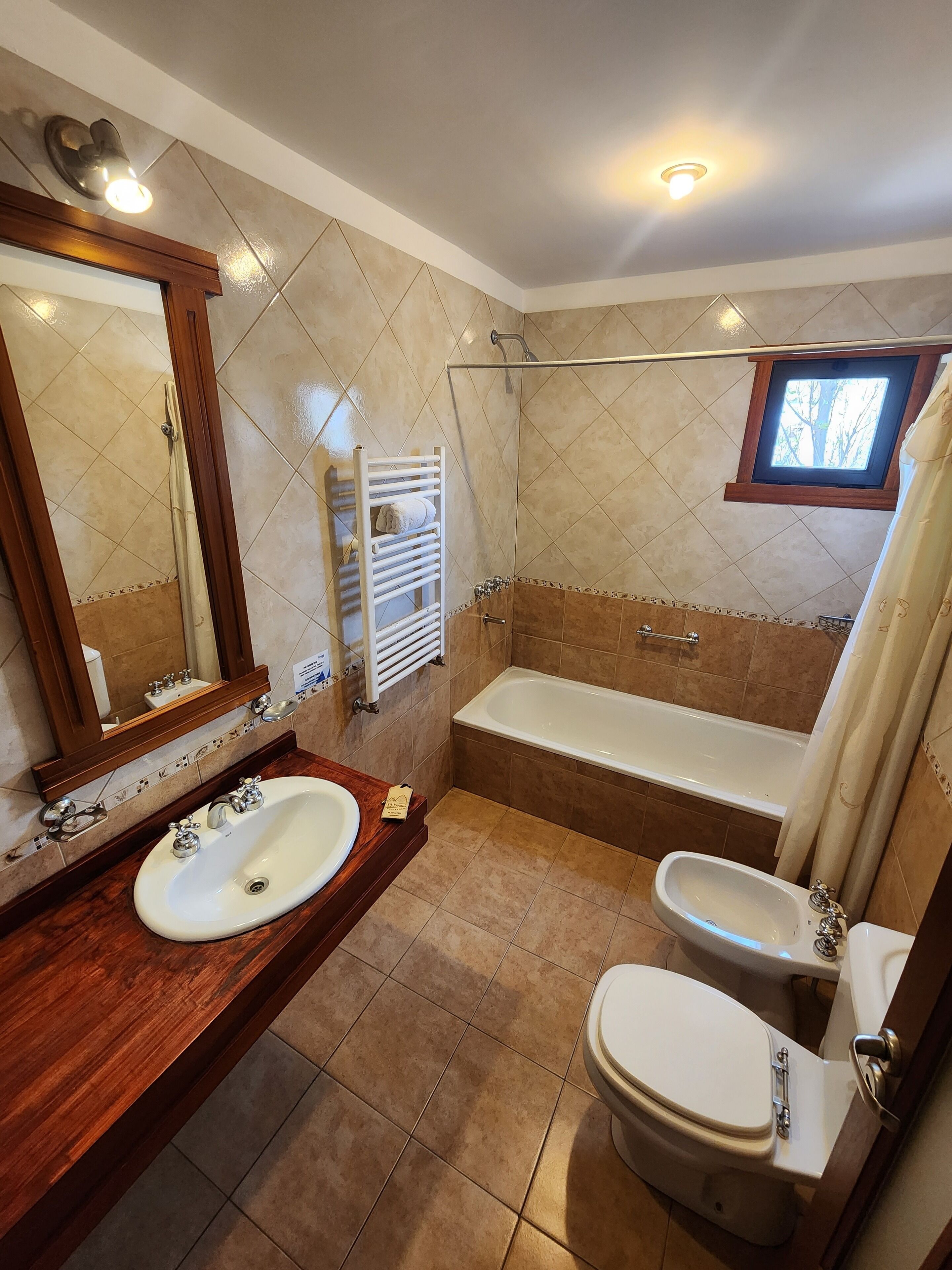 combined shower/bathtub, deep-soaking bathtub, hair dryer, bidet